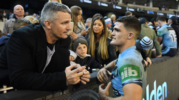 Job done: Nathan Cleary speaks to his father Ivan after his Origin debut.