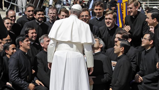 Members of the Legionaries of Christ order kneel in front of Pope Francis at the end of his weekly general audience in St Peter's Square at the Vatican last week.