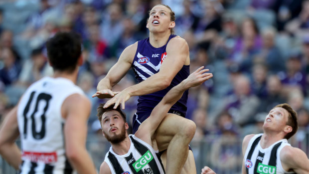 Nat Fyfe jumps high at Optus Stadium last season ... the Dockers captain wants to make the club's new home ground more of a fortress in 2019.