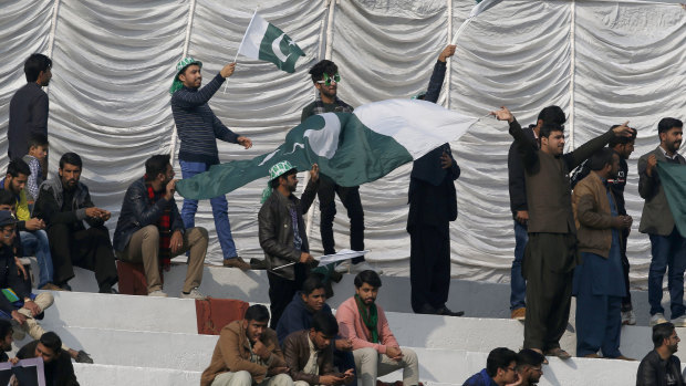 The return: Pakistan fans celebrate a return of Test cricket to their country.