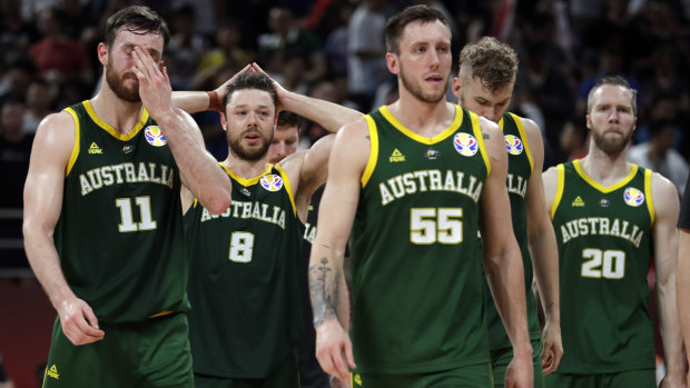 Hoop dreams shattered:  Australian players (from left) Nick Kay, Matthew Dellavedova, Mitch Creek, and David Barlow react after the loss to France in third-place play-off at the FIBA Basketball World Cup in Beijing.