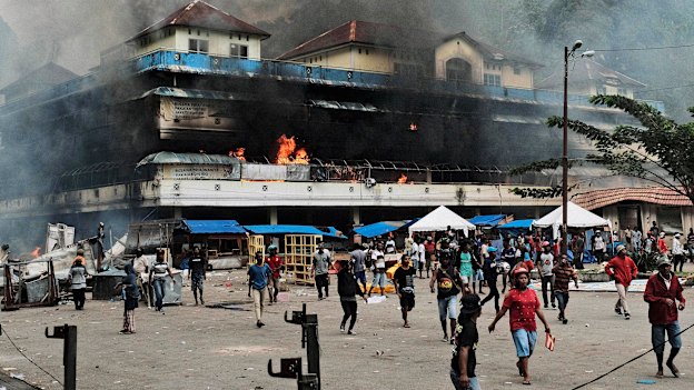 A market burns during a protest in Fakfak, Papua, on August 21.