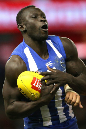 Second chance: Majak Daw takes a mark for the Kangaroos.