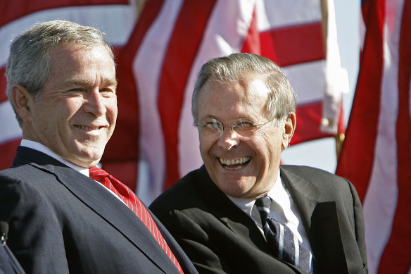 Then US president George W Bush, left, shares a laugh with his secretary of defence Donald Rumsfeld in 2006.