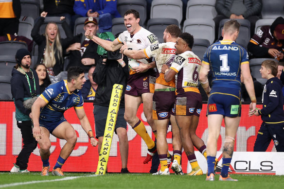 Corey Oates celebrates a try against the Eels.
