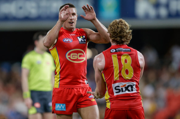 David Swallow and Matt Rowell celebrate a goal.