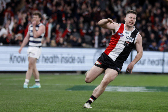 Saint Jack Higgins celebrates one of his two majors against the Cats.