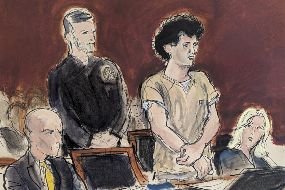 In this courtroom sketch, Sam Bankman-Fried, second from right, stands while addressing the judge before his sentencing. 