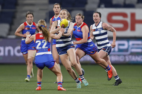 Amy McDonald of Geelong handballs during the round one AFLW match between Geelong Cats and Western Bulldogs at GMHBA Stadium, on September 02, 2023, in Geelong, Australia.