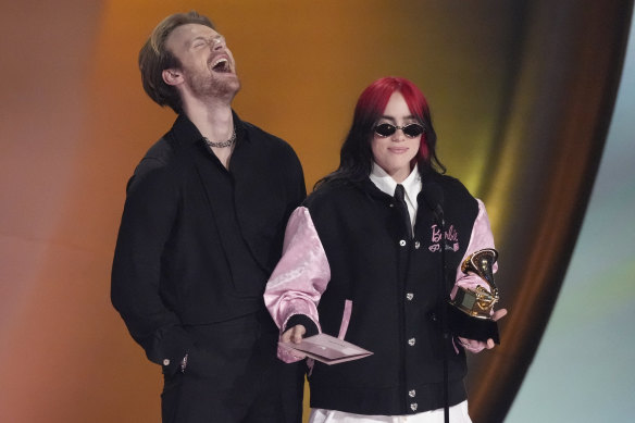 Finneas, left, and Billie Eilish accept the award for song of the year for What Was I Made For?.