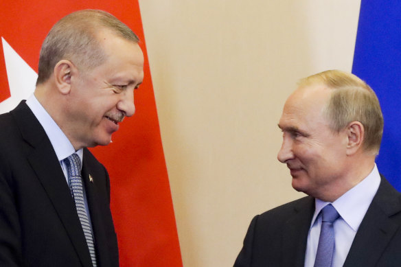 Turkish President Recep Tayyip Erdogan, left, and Russian President Vladimir Putin look at each other during a joint press conference with  following their talks in Russia. 