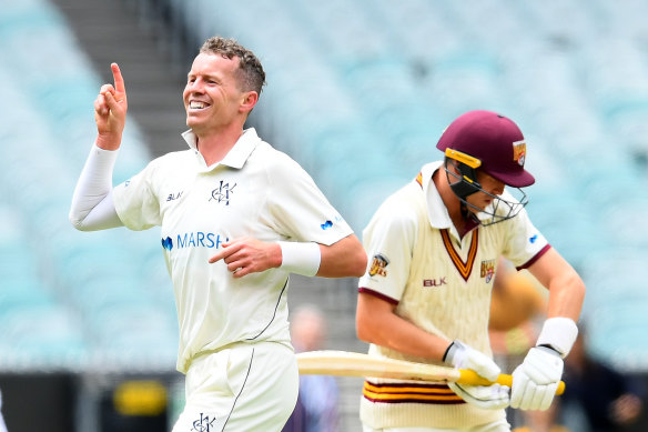 Peter Siddle, left, celebrates after taking the wicket of Marnus Labuschagne. 