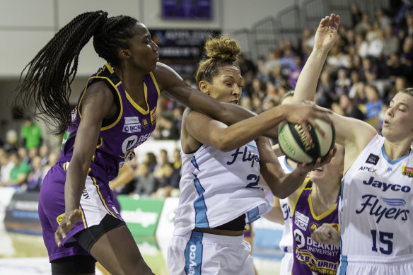 Melbourne Boomers centre Ezi Magbegor (left) takes on WNBA import Mercedes Russell (middle) in the WNBL. The pair will be teammates with Seattle Storm in the WNBA. 