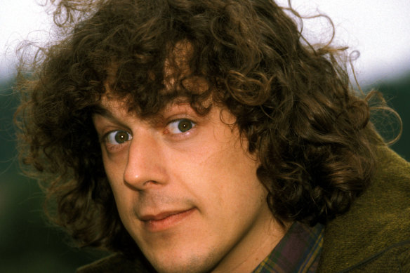 Alan Davies, pictured in 1996, was not allowed to mourn his mother who died when he was only six.