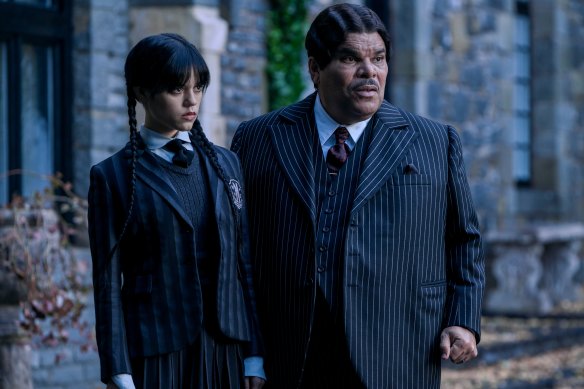 Jenna Ortega as Wednesday Addams and Luis Guzmán as Gomez Addams in Wednesday.