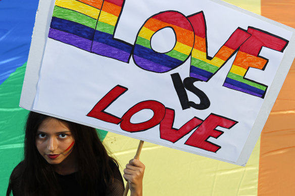 A participant holds a banner during the annual gay pride march in Belgrade, Serbia, which was disrupted by anti-gay protesters.