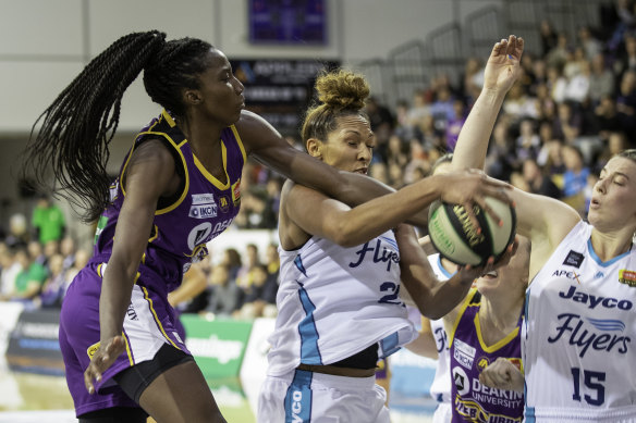 Melbourne Boomers centre Ezi Magbegor (left) takes on WNBA import Mercedes Russell (middle) in the WNBL. The pair will be teammates with Seattle Storm in the WNBA. 