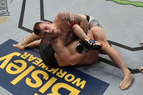 Jimmy Crute secures a kimura submission against Michal Oleksiejczuk.