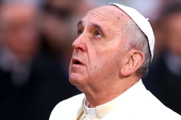 Pope Francis prays in front of the statue of the Immaculate Conception in 2013. 