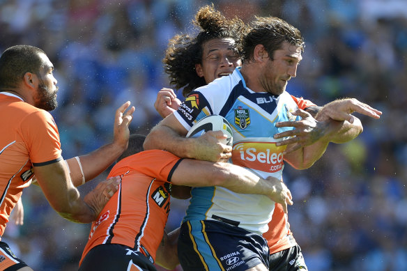 Titans forward David Taylor takes on the Tigers in 42-degree heat on the Gold Coast in March 2014.