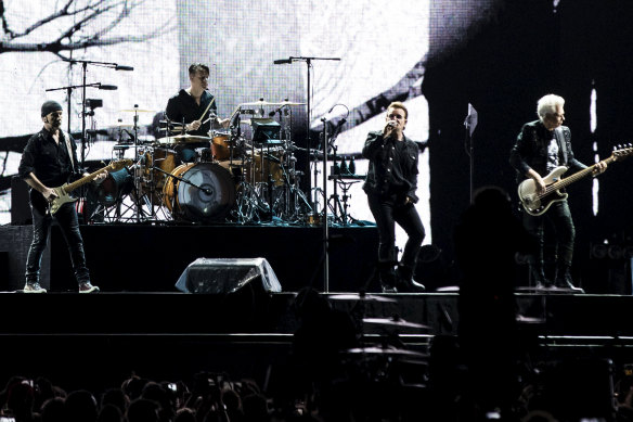 U2 opened the show with all four members performing on a runway deep into the crowd.