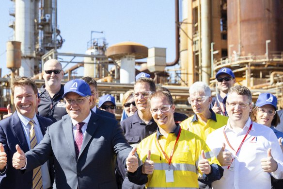 Prime Minister Scott Morrison takes centre stage at Ampol’s Lytton refinery on Monday.