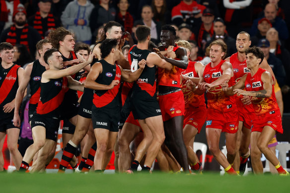 Tempers frayed during a half-time melee between Essendon and Gold Coast players.