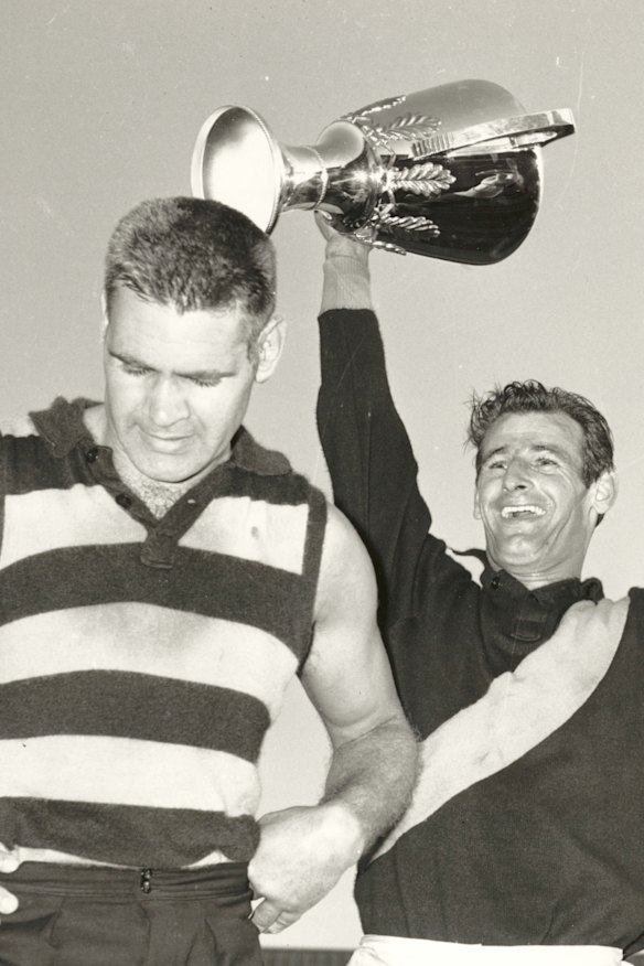 Polly Farmer and Richmond captain Fred Swift holding aloft the 1967 VFL grand final cup. 
