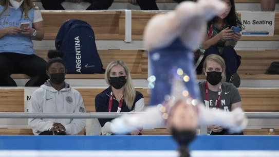Simone Biles watches Lee from the stands.