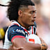 Naufahu Whyte of the Roosters runs the ball.