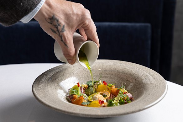 Smoked eel parfait served with summer tomatoes and dressed with tomato consomme that’s poured tableside.