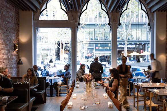 The dining room’s arched Gothic-style windows face Collins Street.