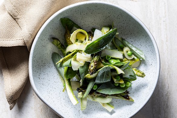 Raw and grilled asparagus with broad bean leaves, peas and basil oil.