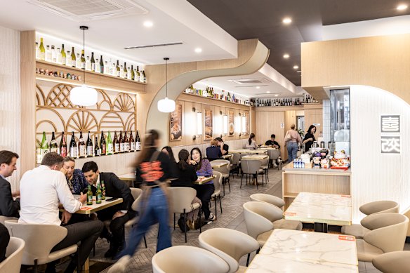 Hoppy Dumpling diners sit in comfy armchairs, and can watch the glassed-in kitchen (right).