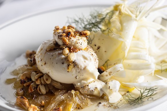 Burrata served over sweet-tart fennel marmellata with pine nuts and coriander seeds.