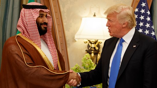 US President Donald Trump, right, shakes hands with Saudi Crown Prince Mohammed bin Salman in Riyadh in 2017. 