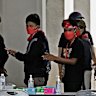 Indonesian trafficking victims wait to be processed at the Thai border after being released.