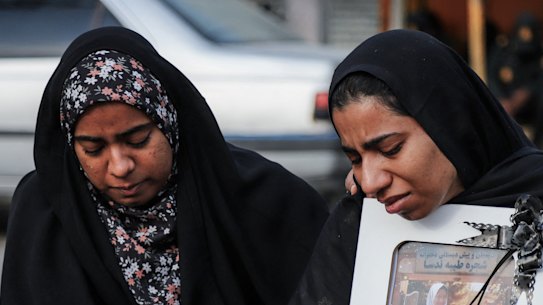 Mourners at a funeral for a child killed in an airstrike on Iran.