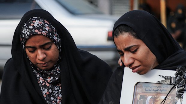 Mourners at a funeral for a child killed in an airstrike on Iran.