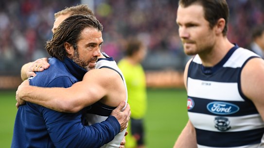 Chris Scott embraces Cats skipper Joel Selwood after the loss.
