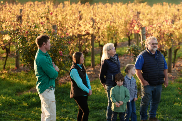 Winemaker Nick Farr, far left, with family and friends in the vineyard.