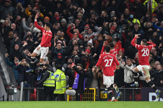Cristiano Ronaldo celebrates what proved the winner and his second goal against Arsenal at Old Trafford.
