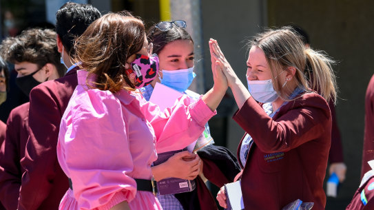 Year 12 students at Marymede Catholic College celebrate finish their English exam.
