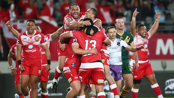 Tonga celebrate their breakthrough win over Australia at Eden Park.