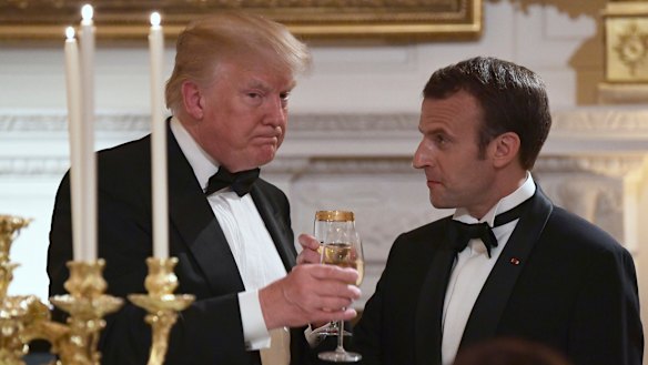 Donald Trump, left, and Emmanuel Macron, share a toast during the State Dinner at the White House.