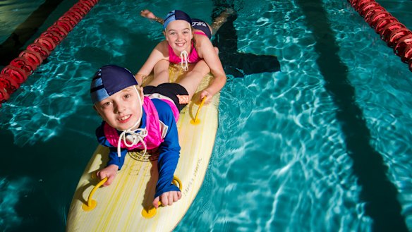 Canberra Nippers Michael Woods, 7, with sister Anastasia, 10, at Civic Pool.