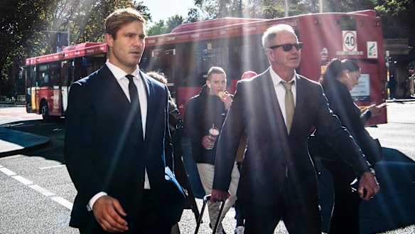 Jack De Belin (left) arrives at the Downing Centre on Wednesday.