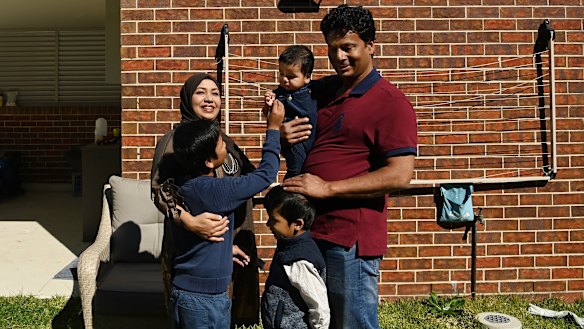 Mohammed Islam with his wife Afsana Fardous and their sons four-year-old Diyan Islam, eight-year-old Shayan Islam and six month-old Sinan Islam in the backyard of their home in Hurstville.