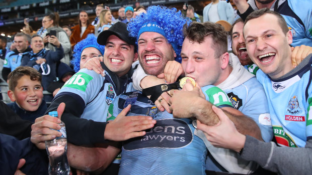 James Tedesco celebrates with fans after after NSW's series victory last year.