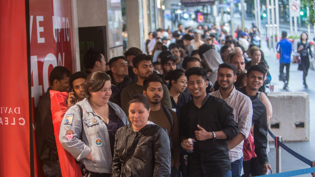 Keen shoppers lined up for hours on Bourke Street. 
